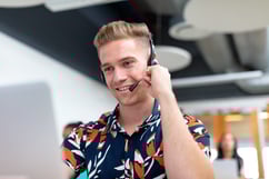 male-customer-service-executive-talking-headset-modern-office